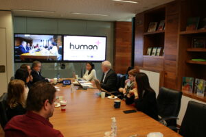 A picture of the panel sitting at a desk at the Human Plus Tech Talk on November 22.